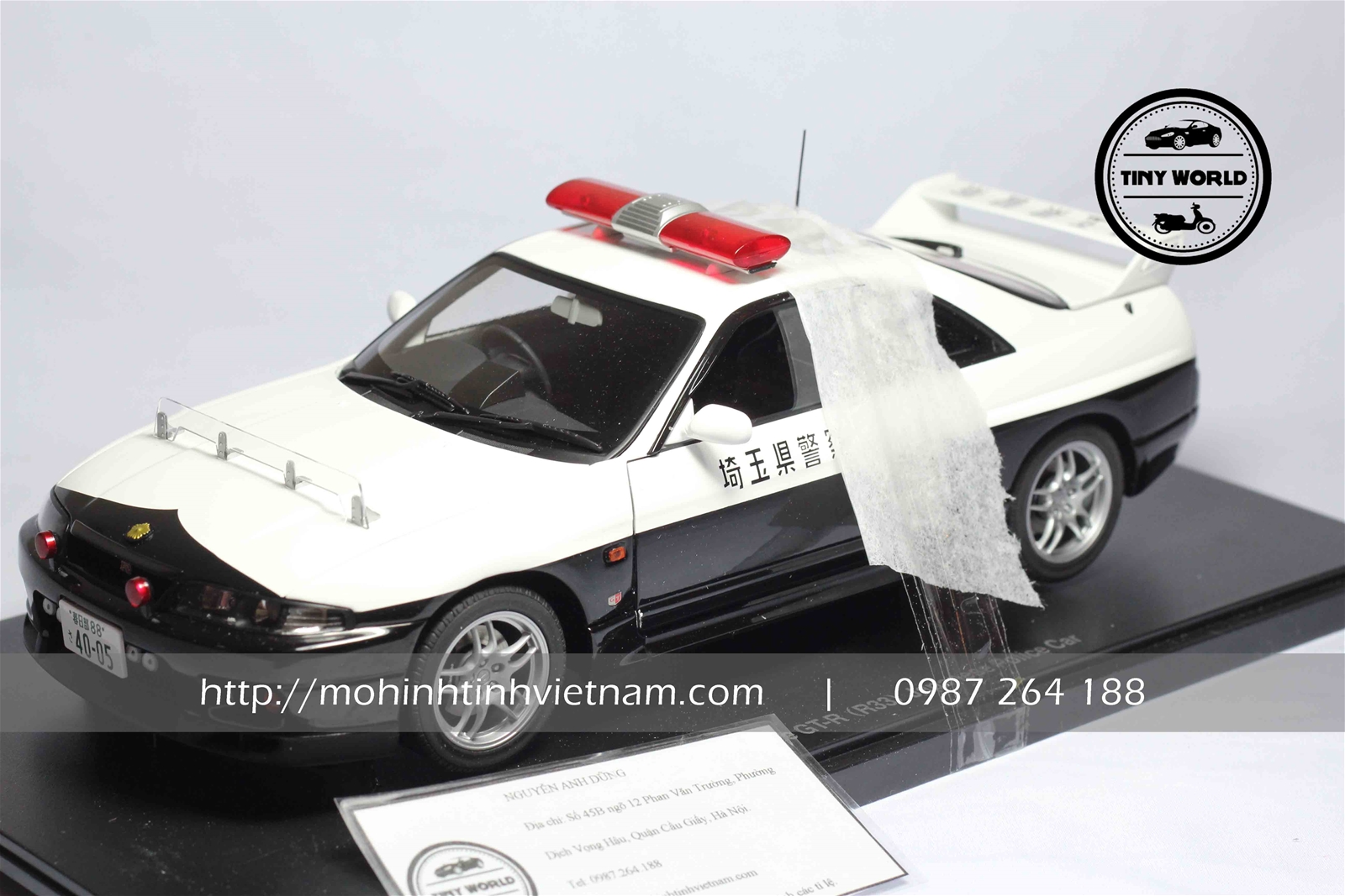 MÔ HÌNH Ô TÔ NISSAN GT-R R33 POLICE (TRẮNG) 1:18 AUTOART